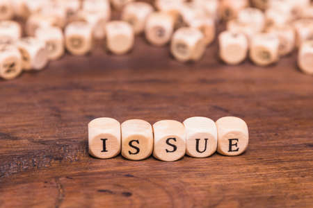 issue word wooden cubes. High quality photoの写真素材