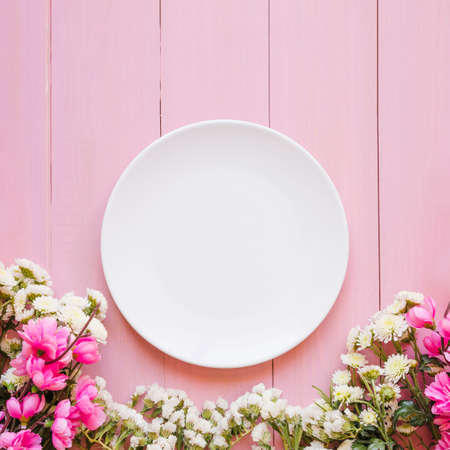 pretty flowers near plate. High quality photoの写真素材