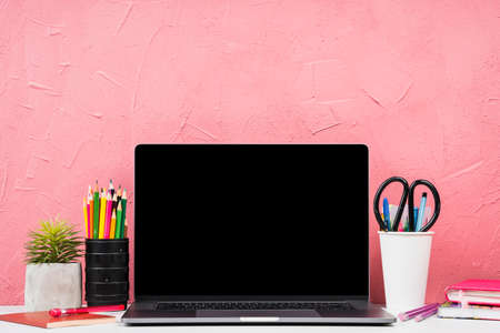 front view laptop with stationery elements. High quality photoの写真素材