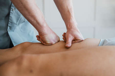 male physiotherapist massage session with female patient. High quality photoの写真素材