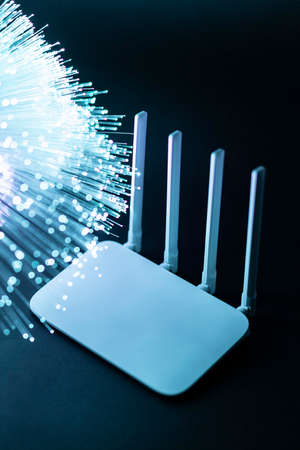 wi fi router with blue optical fiber. High resolution photoの写真素材