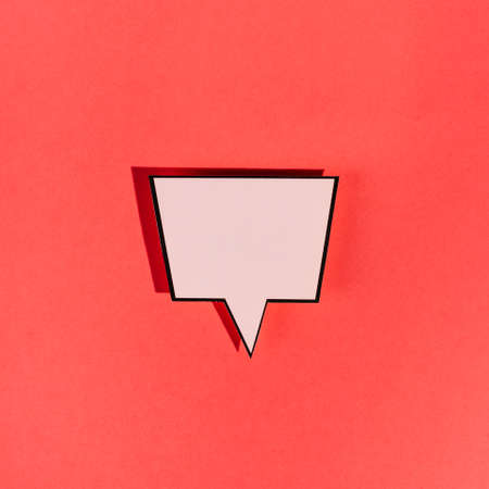 vintage blank pink speech bubble red background. High resolution photoの写真素材