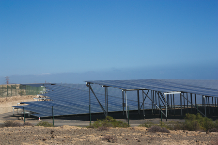 Electric power plant of solar panels where the renewable energy of sunlight is used as raw material