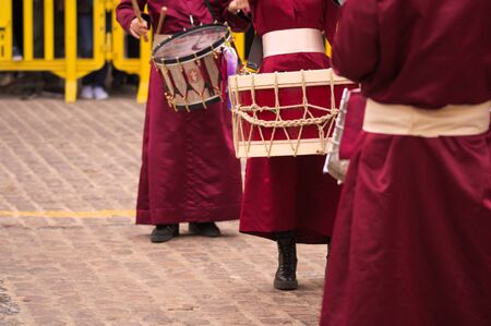 People participating in a typical tamborrada on Good Friday in the Spanish Holy Weekの写真素材