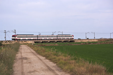 June, 2015. Valencia, Spain. Image of a commuter train that crosses the lagoon of Valencia, Spainのeditorial素材