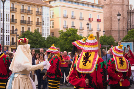 June, 2018. Valencia, Spain. Dance that represents the fight between virtue (la Moma) and the seven deadly sins (los momos) during the Corpus Christi procession in Valencia.のeditorial素材