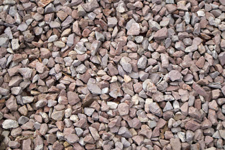 A closeup of gravel and pebbles used to avoid puddles on the sandy soils occupy the image