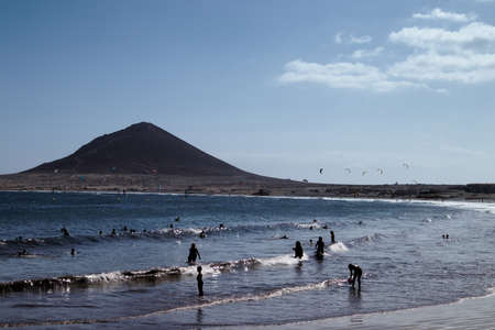 Landscape of El MÃ©dano beach in the south of Tenerife (Canary Islands, Spain) with the volcanic cone in the backgroundの写真素材