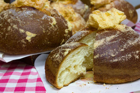 A table with several cakes (mona de pascua) or pancakes(panquemaos). Typical sweet of Valencia...