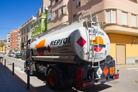 2022. Valencia, Spain. Repsol company fuel delivery truck drives through a small townのeditorial素材