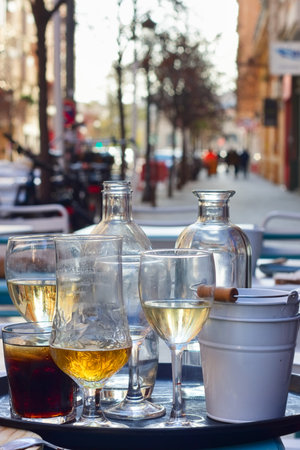 A close-up view of a partially consumed drink tray on a customer table in the street with blurred background and copy spaceの写真素材