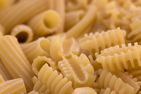 Mixture of short Italian pasta known as radiator and elicoidal macaroni. Background for foodの写真素材