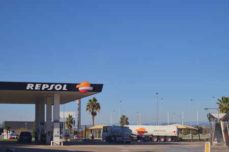 General shot of a gas station belonging to the multinational company Repsol, a fuel supplier, where there are some parked cars. Image with copy space.のeditorial素材