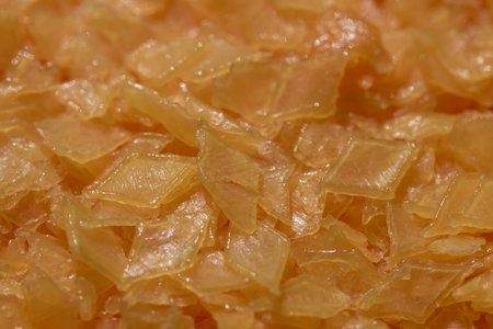 Detail of the orange diamond shaped soap flakes that are used to wash clothes in the automatic...