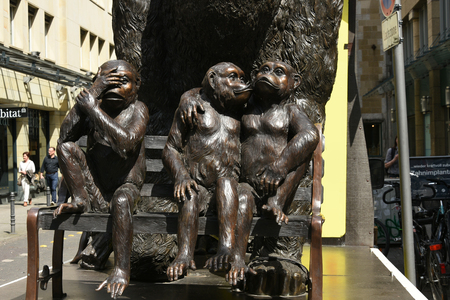 may, 2017,Three Monkeys Sitting on Bench Sculpture Bronze in Koln,Cologne, Germany,のeditorial素材