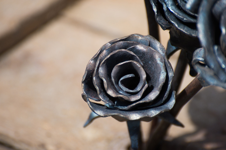 A metal forged rose in hot fireの写真素材