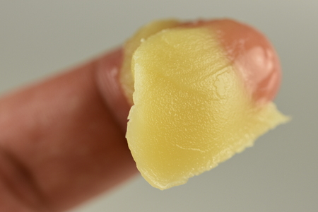 yelow gel on fingerの写真素材