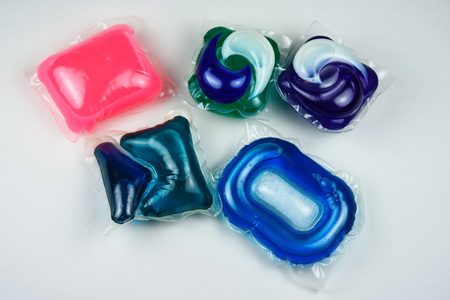 Gel capsules with laundry detergent.