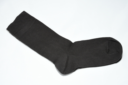 Closeup black socks on white background.の写真素材