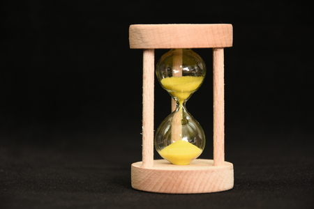 hourglass with yellow  sandの写真素材