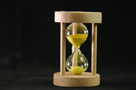 Hourglass on black background