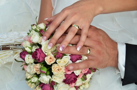 Just married couple showing ringsの写真素材