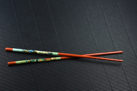 Old Asian chopsticks isolatedの写真素材