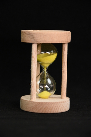 Hourglass on black background