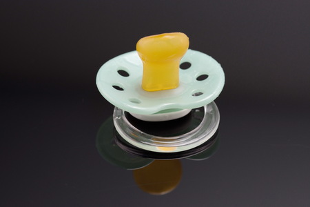 green orthodontic pacifierの写真素材
