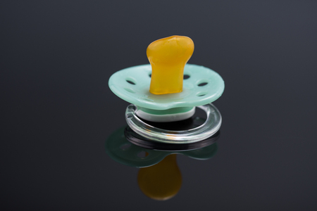 green orthodontic pacifierの写真素材