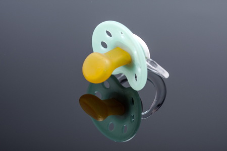 green orthodontic pacifierの写真素材