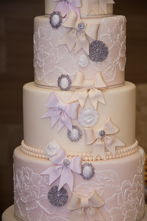 White wedding cake decorated with sugar flowers