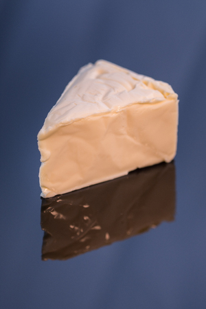 Cheese triangles on a black acrylic  surface,Processed cheeseの写真素材