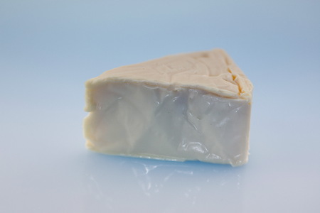 Cheese triangles on blue background ,Processed cheeseの写真素材