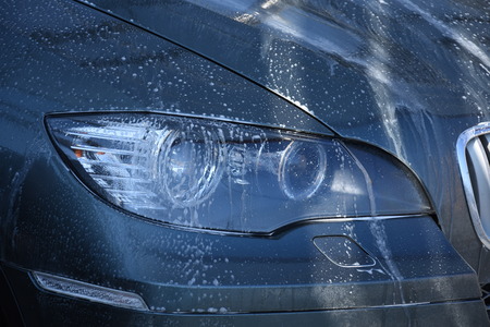 Modern auto headlight ,Car washの写真素材