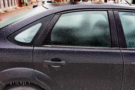 Freezing rain ice coated car.,side windowの写真素材