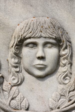 BISTRITA, ROMANIA, statue in cemetery, BABY FACE SCULPTUREの写真素材
