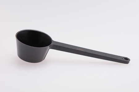 Black plastic coffee scoop isolated on a white backgroundの写真素材