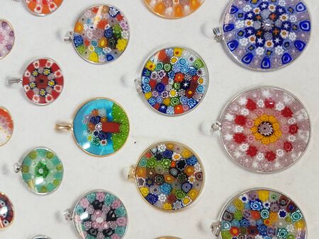 Collection of colorful glass beads of different sizes and shapes. Colored Venetian, Murano glass