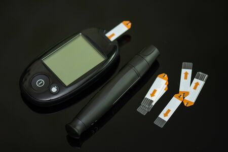 Blood glucose meter for diabetics   with lancet device  , Blood Glucose Test Stripの写真素材