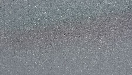 Gray clothing reflective tape. Close-up, selective focus. Highly reflective stripes for high visibility clothing in dark time.の写真素材