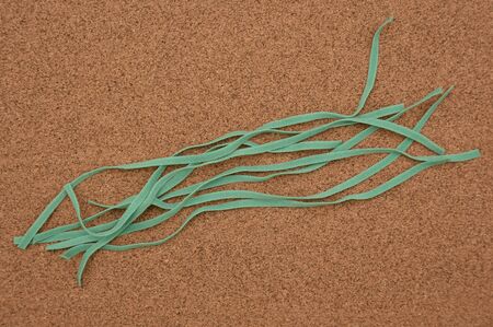 small pieces of green elastic on black , green Elastic band,detail