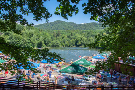 Romania 2020, People enjoying the sunshine on a hot summer day at the Bear Lake Thermal Spa in Sovata, Transylvania,のeditorial素材