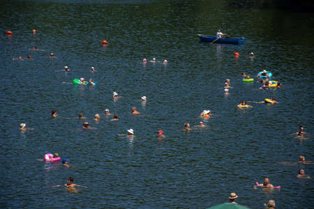 Romania 2020, People enjoying the sunshine on a hot summer day at the Bear Lake Thermal Spa in...