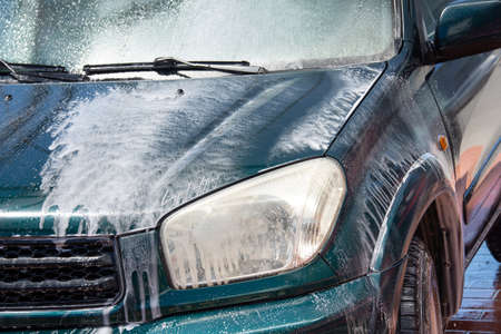 High pressure washing car outdoorsの写真素材