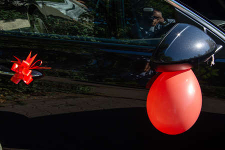 wedding car decorated with red elementsの写真素材