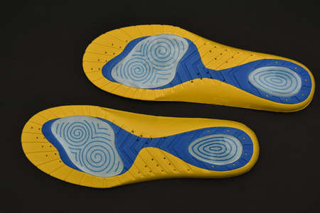 New orthopedic  Shoe Insoles on black  backgroundの写真素材