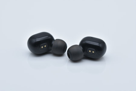 A pair of rechargeable ear-plug headphone