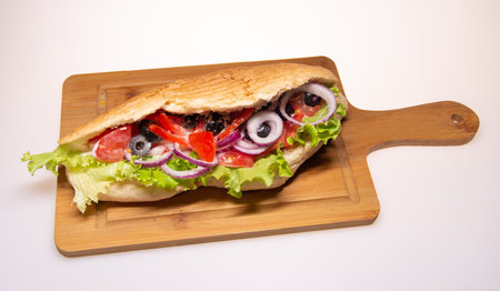 Fresh tasty burger with onions and tomatoesの写真素材