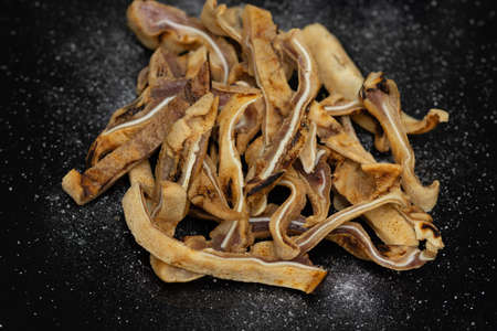 fried pork ear and seasoned with saltの写真素材